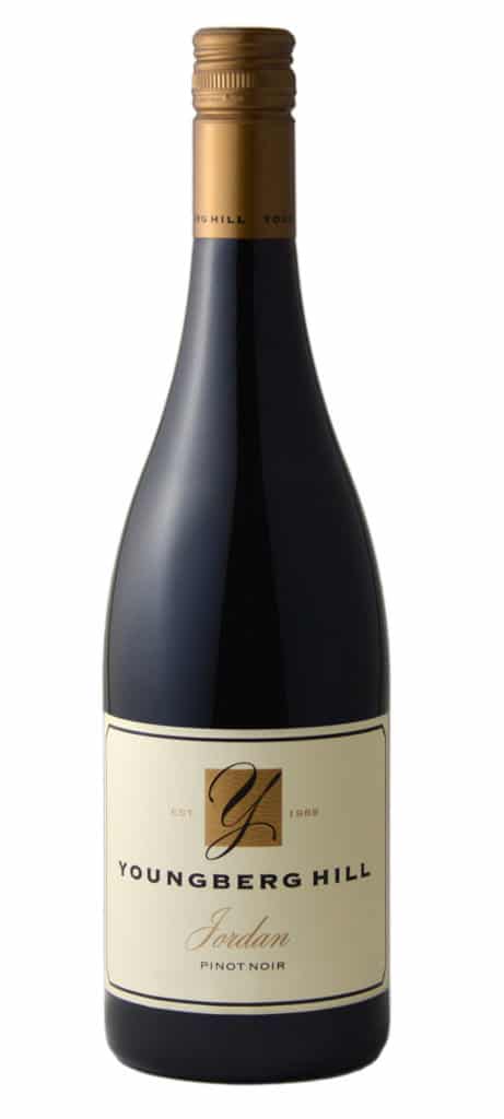 A bottle of Youngberg Hill wine with a beige label, gold logo, and gold screw cap, isolated on white.