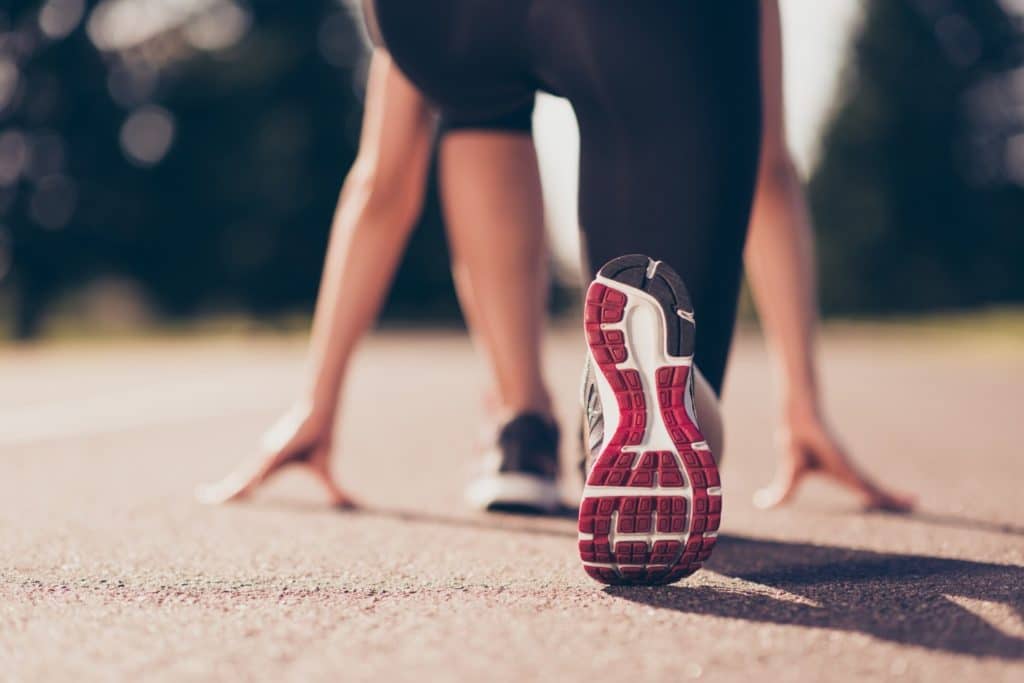 What You Need to Know About This Year's Willamette Valley Marathon and Wine Festival 1 woman preparing to run