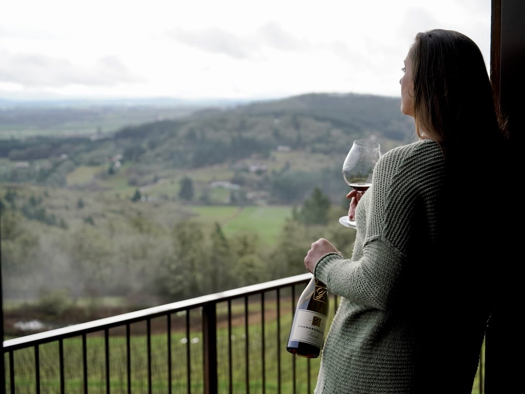 Woman enjoying the view at one of the top wineries in the Willamette Valley, at our McMinnville Bed and Breakfast