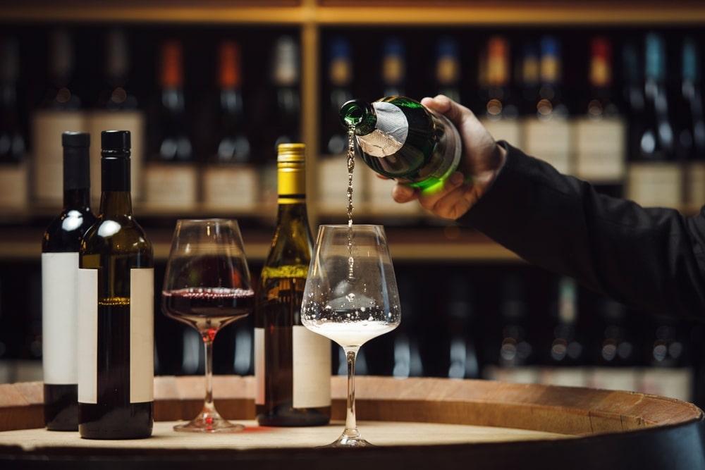 The Perfect Sparkling Wine for the Holidays 1 Sommelier pouring a glass of Oregon Sparkling wine and Willamette Valley Pinot Noir